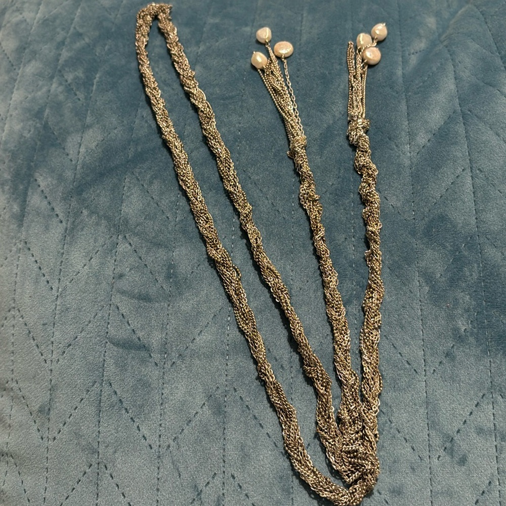 Intricate silver tone, lariat style necklace with drop freshwater pearls on ends